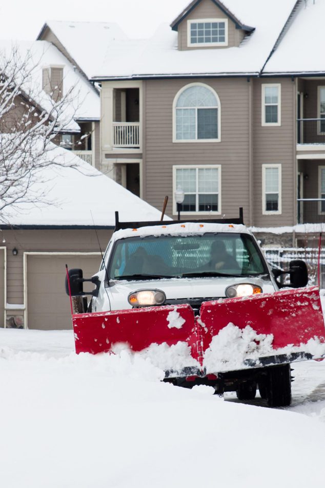 large-pickup-truck-with-snow-plow-clearing-dryway-aparment-complex-image large-pickup-truck-with-snow-plow-clearing-dryway-aparment-complex-image